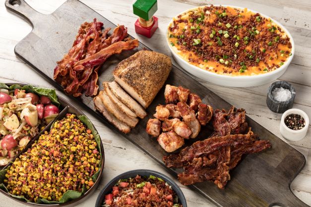 Bacon Fest Returns this October a wooden board with food on it